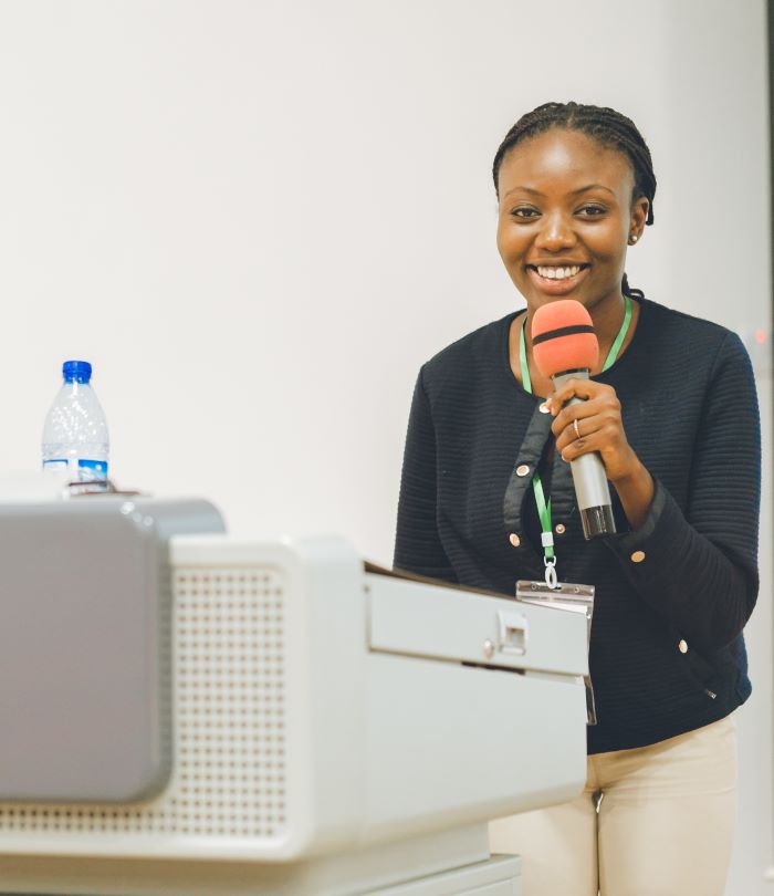 A member of the November 26 team presenting at a company event